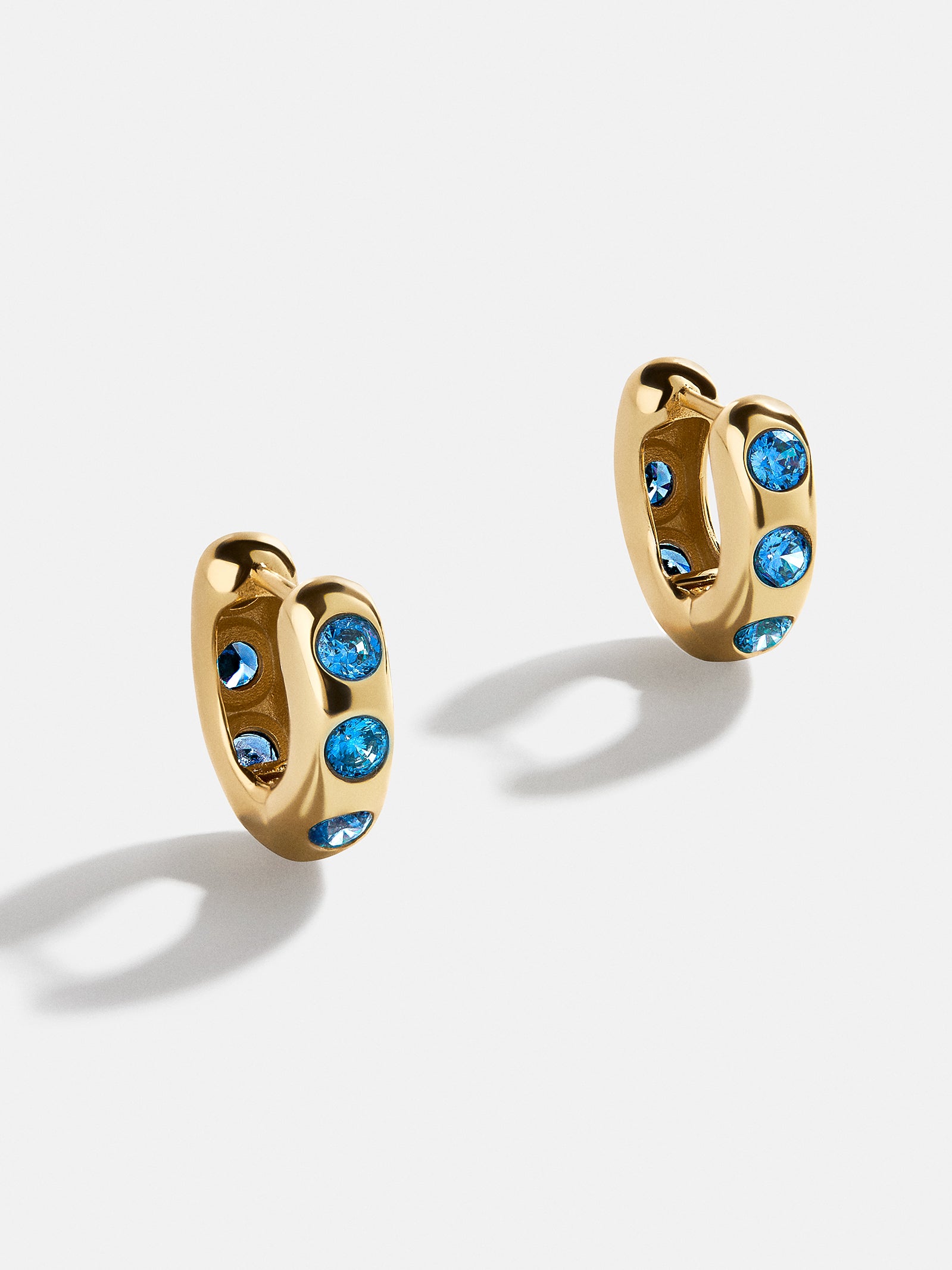 Premium Sydney 18k Gold Birthstone Earrings - Blue Zircon Huggies